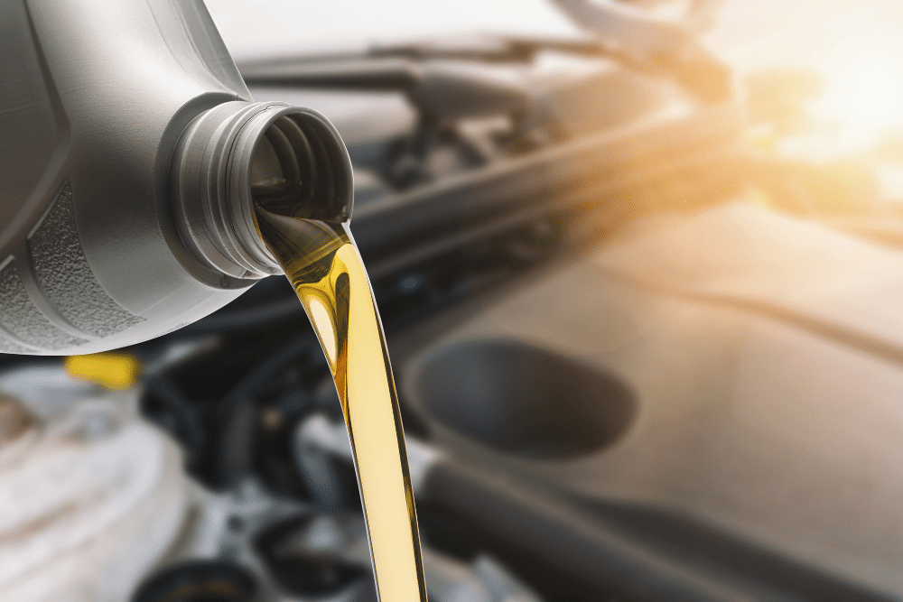 Oil change, auto repair in Rancho Santa Margarita, CA, at Bobby Grich Auto Repair of RSM. Image of a fresh motor oil being poured into a vehicle's engine during a routine oil change service, highlighting the importance of regular maintenance to protect engine performance, improve fuel efficiency, and extend vehicle lifespan.